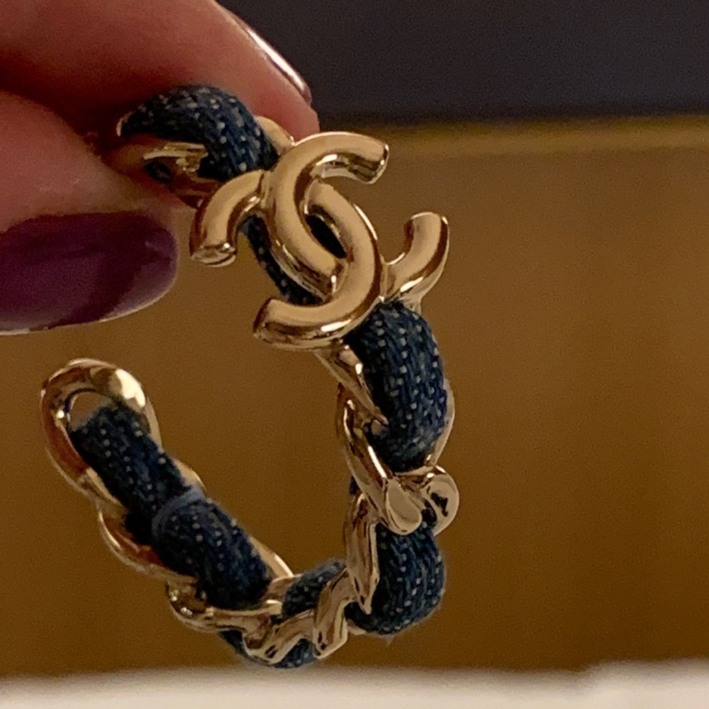 Brand new rare and collectible limited edition denim hoops larger earrings.Must!